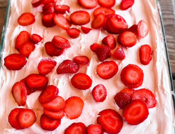 custard pudding layer cake with cool whip and strawberries